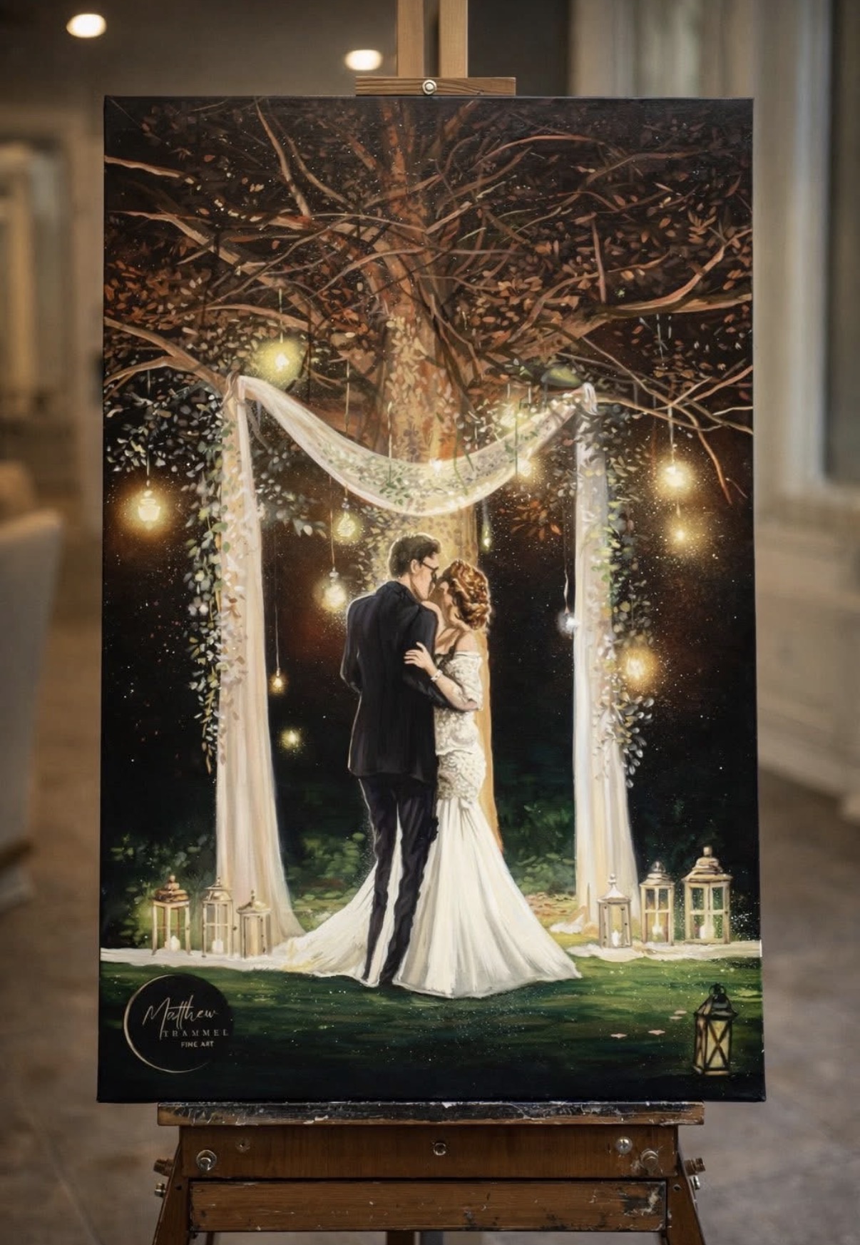 Finished wedding painting of a couple beneath glowing tree lights