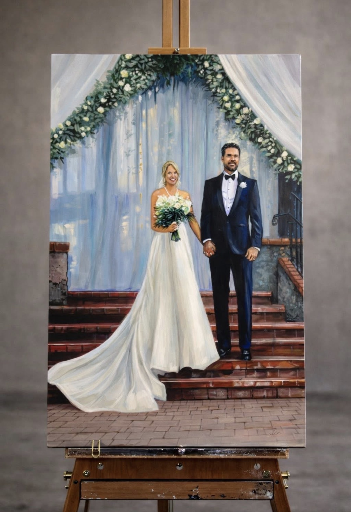 Finished live wedding painting of a bride and groom at their ceremony